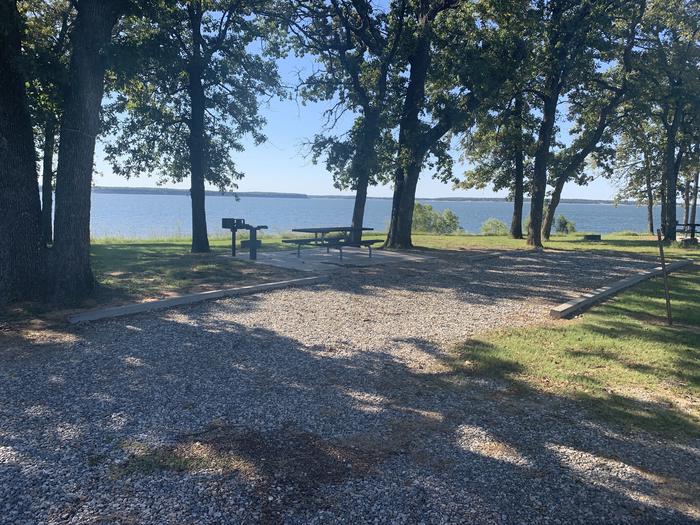 A photo of Site B14 of Loop B at BURNS RUN WEST with Picnic Table, Electricity Hookup, Fire Pit, Shade, Waterfront, Water Hookup