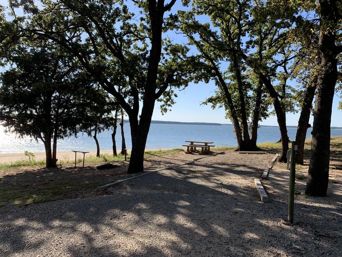 A photo of Site D36 of Loop D at BURNS RUN WEST with Picnic Table, Electricity Hookup, Fire Pit, Shade, Waterfront, Water Hookup
