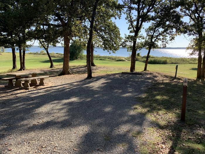 A photo of Site D43 of Loop D at BURNS RUN WEST with Picnic Table, Electricity Hookup, Fire Pit, Shade, Waterfront, Water Hookup