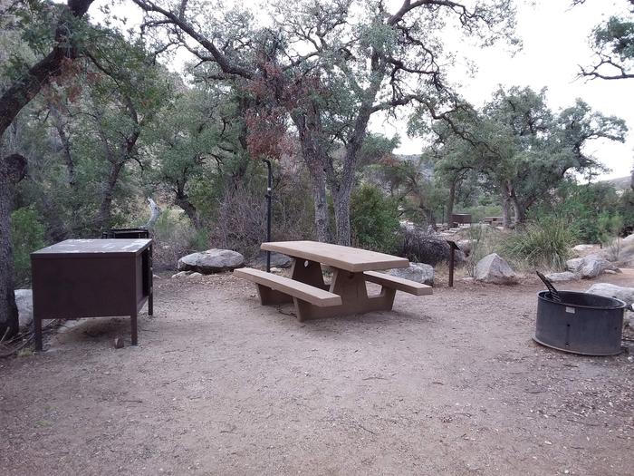Site 6 with a picnic table, campfire ring, food storage, camp grill, and a lantern pole.Site 6 with a picnic table, campfire ring, food storage, camp grill, and a lantern pole. Parking is within close walking distance.