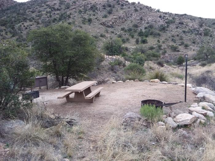 Site 15 with a picnic table, lantern pole, food storage, campfire ring, and parking.Site 15 with a picnic table, lantern pole, food storage, campfire ring, and parking. Parking is within close walking distance.