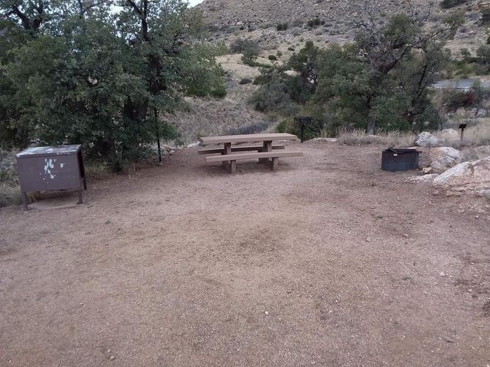 Site 16 with a picnic table, campfire ring, food storage, lantern pole, and grill.Site 16 with a picnic table, campfire ring, food storage, lantern pole, and grill. Parking is within close walking distance.