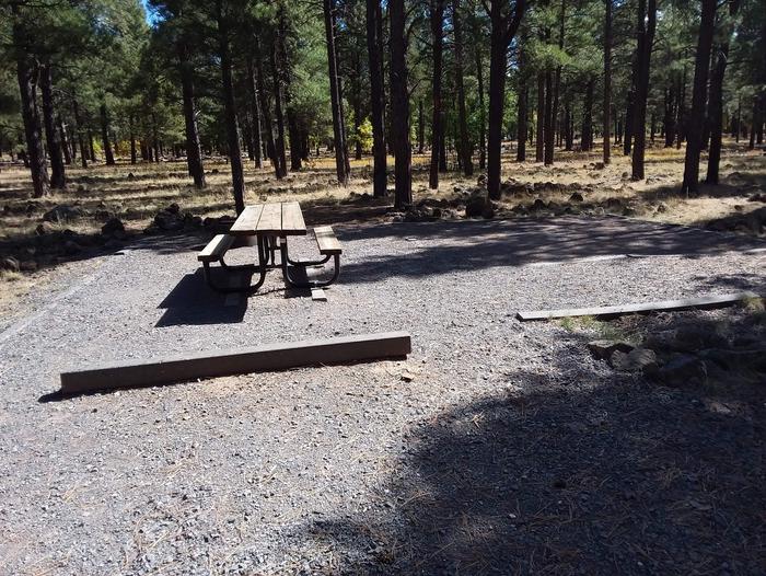 Site 26 with a table on gravel area.Campsite 26 