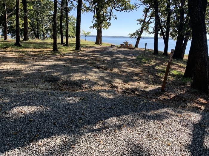 A photo of Site E18 of Loop E at BURNS RUN WEST with Picnic Table, Electricity Hookup, Fire Pit, Shade, Waterfront