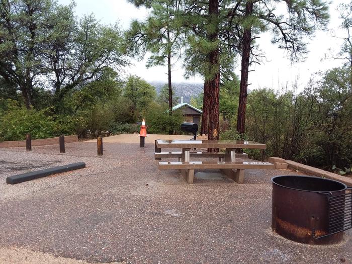 Yavapai Campsite 06 with a picnic table, fire ring, grill and nearby restroom