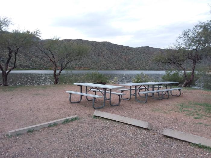 Site 36 with picnic tables, a fire ring, and parking.