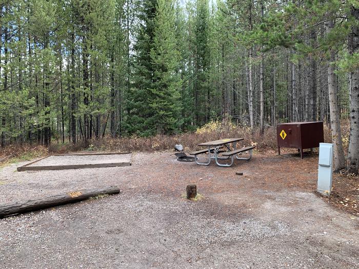 A photo of Site 20 of Loop 1 at Signal Mountain Lodge Campground with Picnic Table, Electricity Hookup, Fire Pit, Shade, Food Storage, Tent Pad