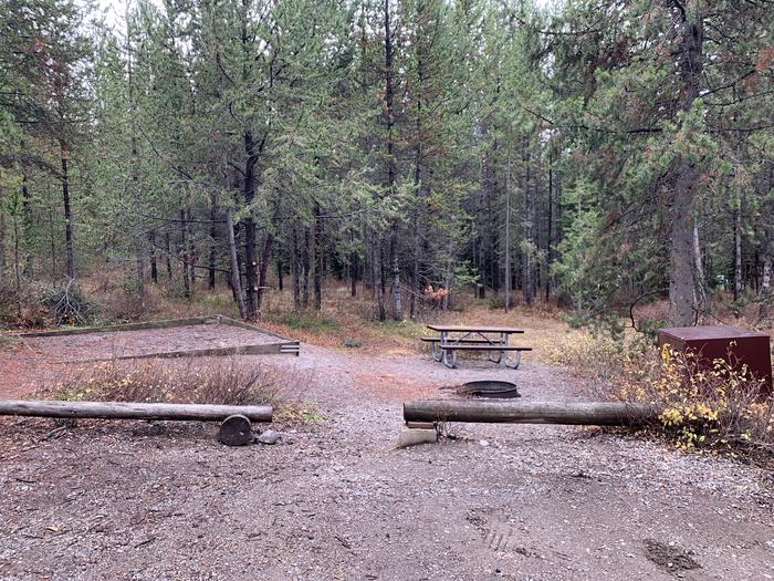 A photo of Site 27 of Loop 1 at Signal Mountain Lodge Campground with Picnic Table, Electricity Hookup, Fire Pit, Shade, Food Storage, Tent Pad