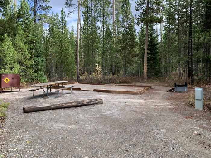 A photo of Site 18 of Loop 1 at Signal Mountain Lodge Campground with Picnic Table, Electricity Hookup, Fire Pit, Shade, Food Storage, Tent PadADA Accessible. 