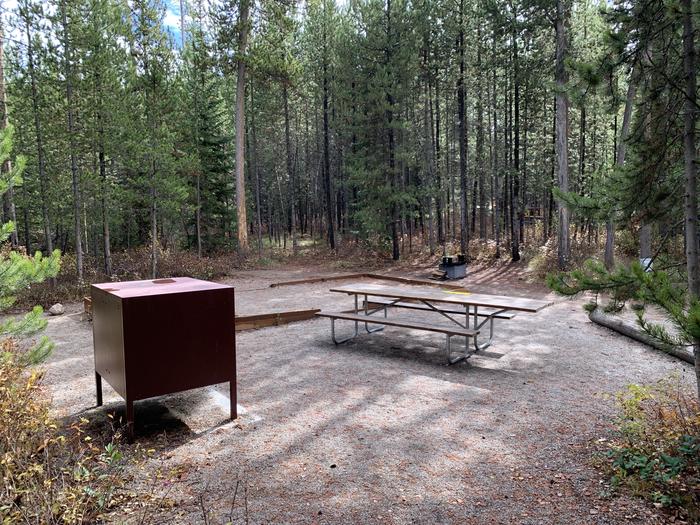 A photo of Site 18 of Loop 1 at Signal Mountain Lodge Campground with Picnic Table, Electricity Hookup, Fire Pit, Shade, Food Storage, Tent PadADA Accessible.