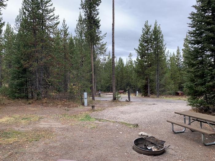 A photo of Site 35 of Loop 1 at Signal Mountain Lodge Campground with Picnic Table, Electricity Hookup, Fire Pit, Shade, Food Storage