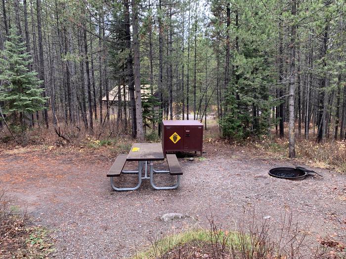 A photo of Site 21 of Loop 1 at Signal Mountain Lodge Campground with Picnic Table, Fire Pit, Shade, Food Storage