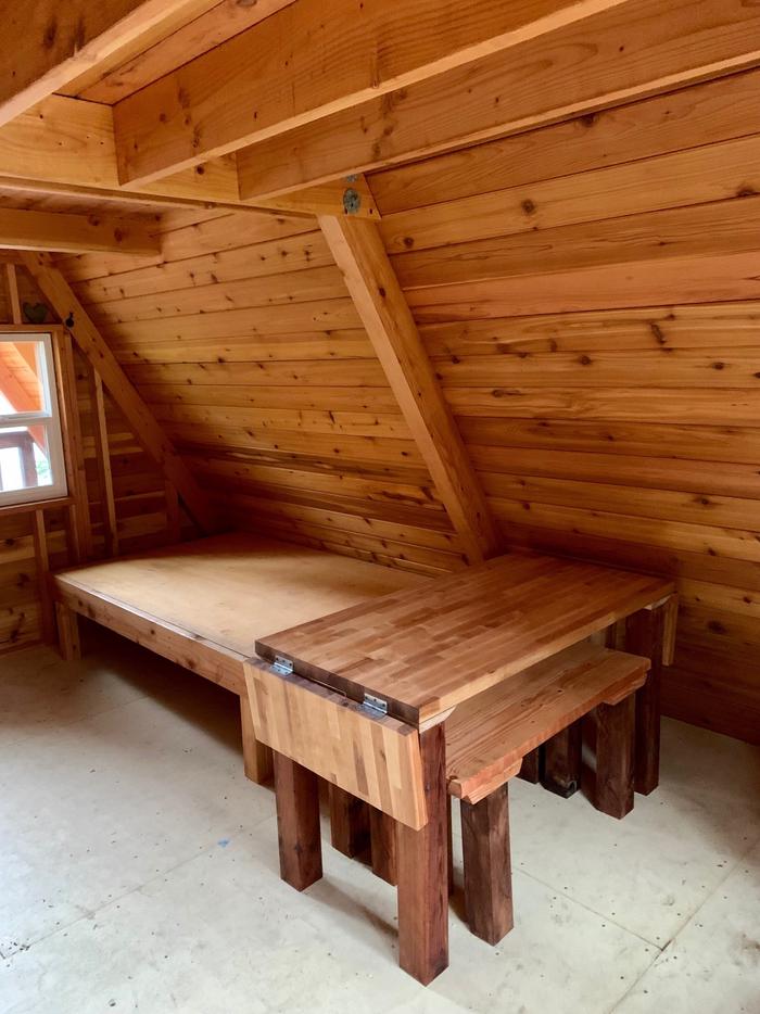 Goose Bay Cabin -- InteriorBed and custom table/ benches
