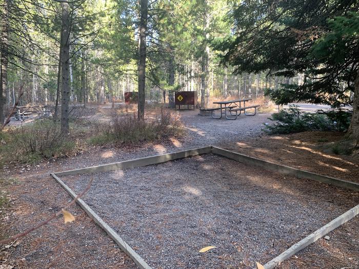 A photo of Site 63 of Loop 2 at Signal Mountain Lodge Campground with Picnic Table, Fire Pit, Shade, Food Storage, Tent Pad