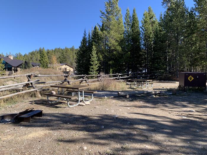 A photo of Site 11 of Loop 1 at Signal Mountain Lodge Campground with Picnic Table, Electricity Hookup, Fire Pit, Shade, Food Storage, Tent Pad