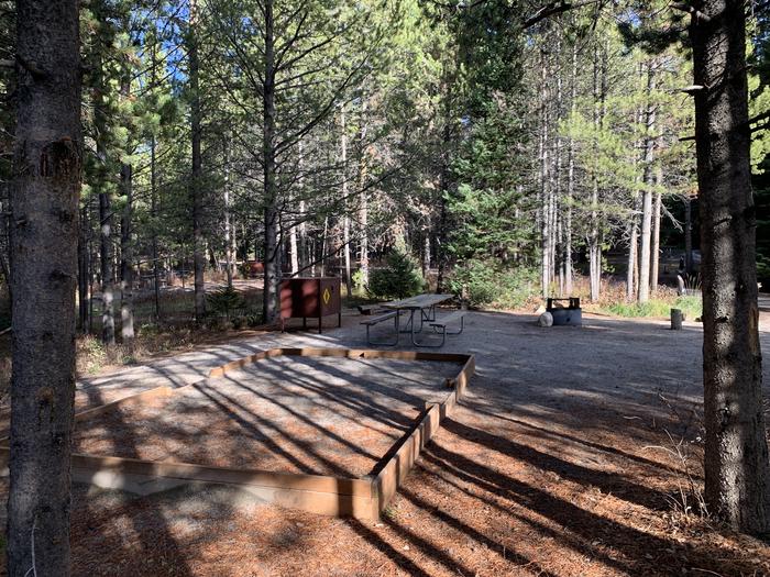 A photo of Site 55 of Loop 2 at Signal Mountain Lodge Campground with Picnic Table, Fire Pit, Shade, Food Storage, Tent PadADA Accessible.
