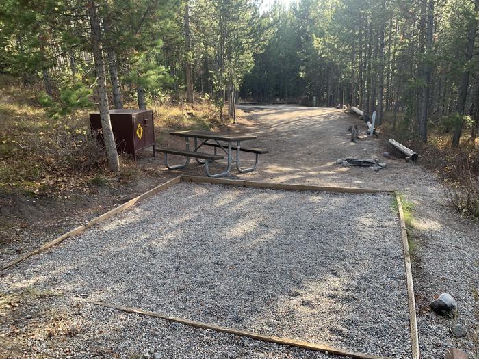 A photo of Site 26 of Loop 1 at Signal Mountain Lodge Campground with Picnic Table, Fire Pit, Shade, Food Storage, Tent Pad