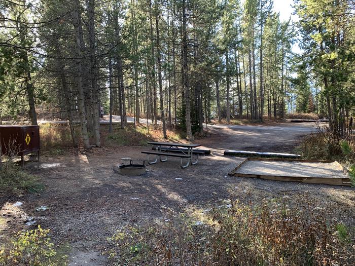 A photo of Site 47 of Loop 2 at Signal Mountain Lodge Campground with Picnic Table, Fire Pit, Shade, Food Storage, Tent Pad