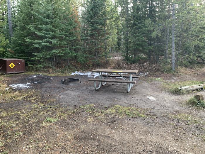 A photo of Site 37 of Loop 1 at Signal Mountain Lodge Campground with Picnic Table, Electricity Hookup, Fire Pit, Shade, Food Storage