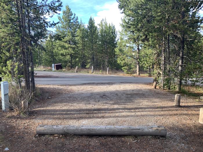 A photo of Site 32 of Loop 1 at Signal Mountain Lodge Campground with Picnic Table, Electricity Hookup, Fire Pit, Shade, Food Storage, Tent Pad