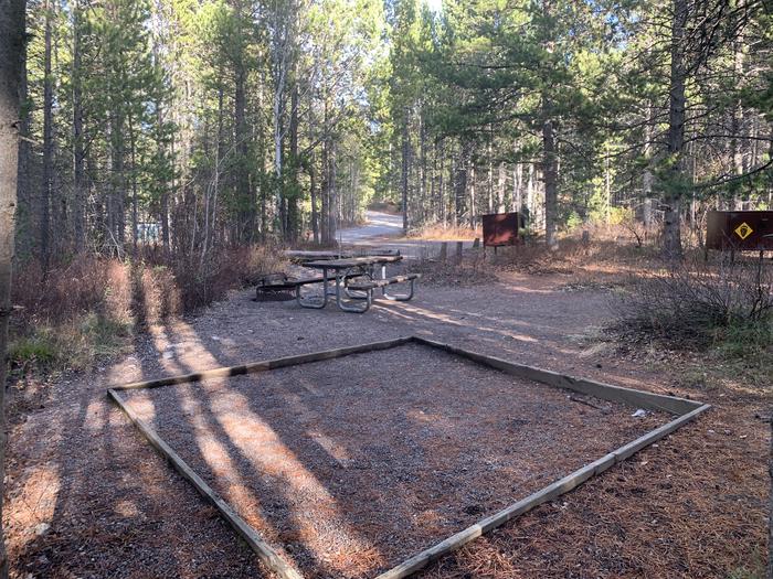 A photo of Site 64 of Loop 2 at Signal Mountain Lodge Campground with Picnic Table, Fire Pit, Shade, Food Storage, Tent Pad