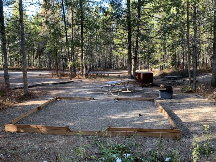 A photo of Site 46 of Loop 2 at Signal Mountain Lodge Campground with Picnic Table, Fire Pit, Shade, Food Storage, Tent PadADA Accessible.