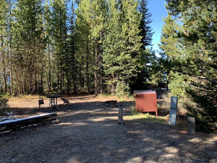A photo of Site 5 of Loop 1 at Signal Mountain Lodge Campground with Picnic Table, Electricity Hookup, Fire Pit, Shade, Food Storage