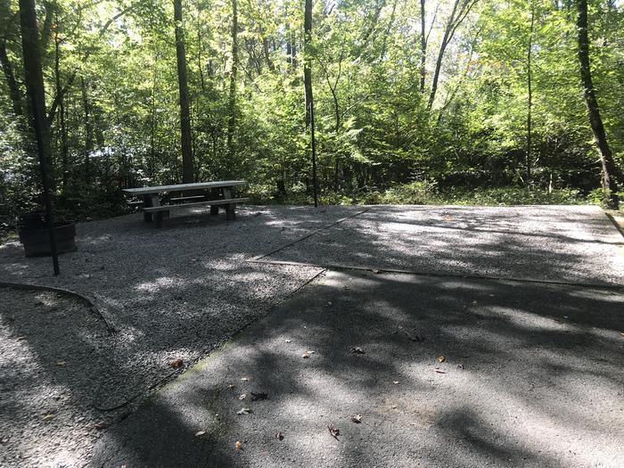 A photo of Site A014 of Loop A at TWIN KNOBS CAMPGROUND with Picnic Table, Electricity Hookup, Fire Pit, Shade, Tent Pad, Lantern Pole