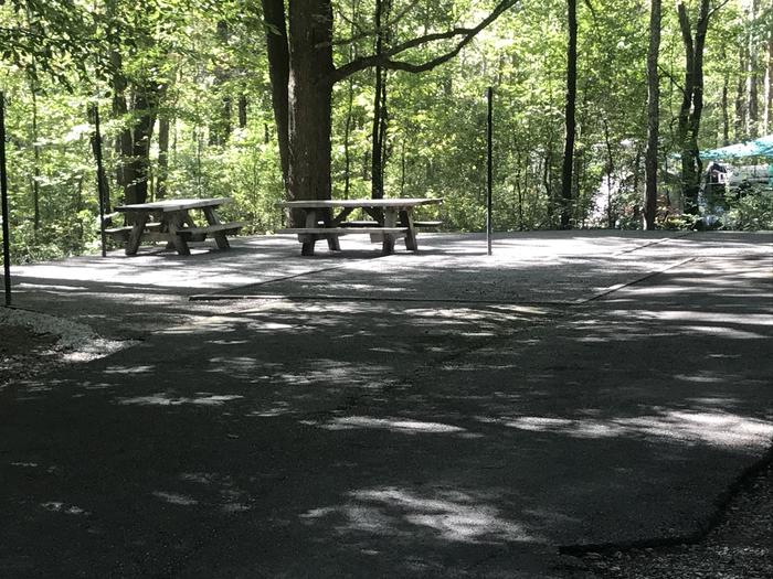 A photo of Site A015 of Loop A at TWIN KNOBS CAMPGROUND with Picnic Table, Electricity Hookup, Fire Pit, Shade, Tent Pad, Lantern Pole