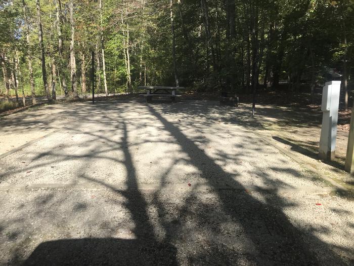 A photo of Site A008 of Loop A at TWIN KNOBS CAMPGROUND with Picnic Table, Electricity Hookup, Fire Pit, Shade, Tent Pad, Lantern Pole