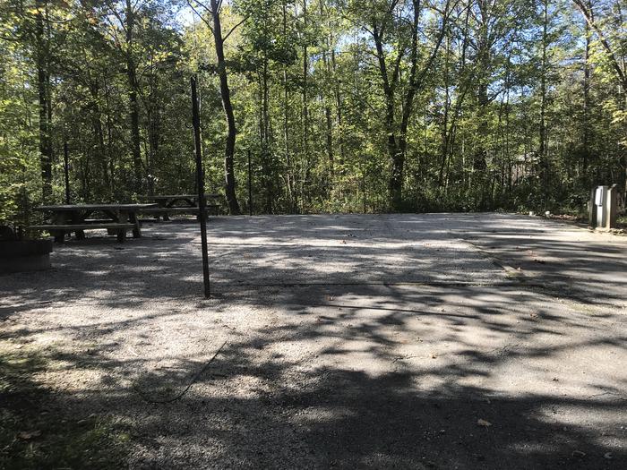 A photo of Site B017 of Loop B at TWIN KNOBS CAMPGROUND with Picnic Table, Fire Pit, Shade, Tent Pad, Full Hookup, Lantern Pole