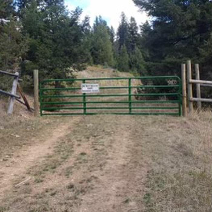 View of the green gate leading to Lost Horse cabinView of the green gate leading to Lost Horse cabin. The combination is the same as the cabin. Lock the gate behind you when entering. Cabin is 0.3 miles ahead.