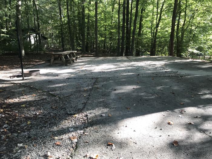 A photo of Site F018 of Loop F at TWIN KNOBS CAMPGROUND with Picnic Table, Fire Pit, Shade, Tent Pad, Lantern Pole