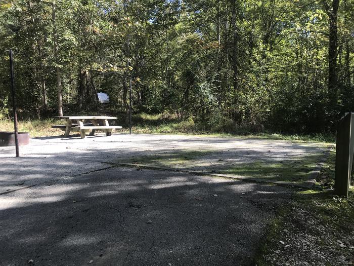 A photo of Site B007 of Loop B at TWIN KNOBS CAMPGROUND with Picnic Table, Electricity Hookup, Fire Pit, Shade, Tent Pad, Lantern Pole
