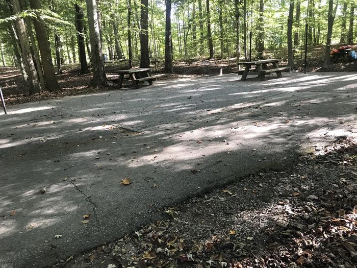 A photo of Site F017 of Loop F at TWIN KNOBS CAMPGROUND with Picnic Table, Fire Pit, Shade, Tent Pad, Lantern Pole