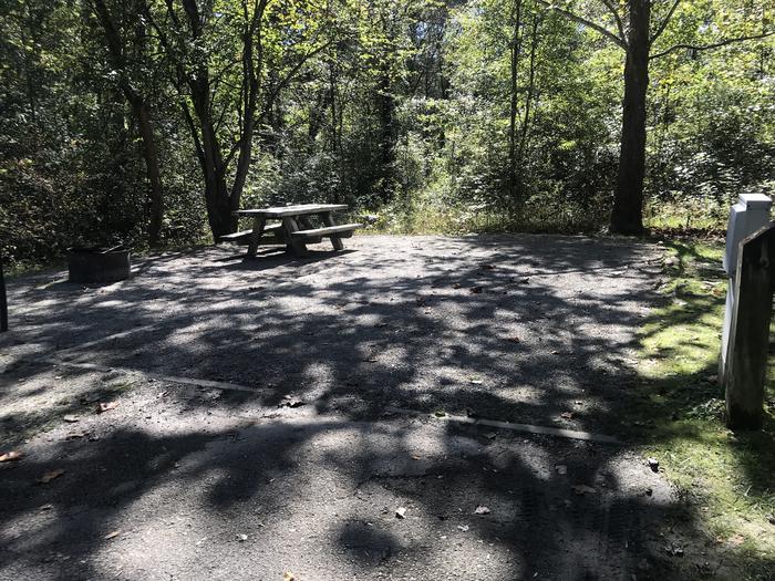 A photo of Site A036 of Loop A at TWIN KNOBS CAMPGROUND with Picnic Table, Electricity Hookup, Fire Pit, Shade, Tent Pad, Lantern Pole