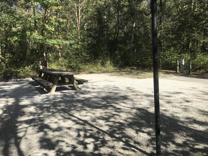 A photo of Site B009 of Loop B at TWIN KNOBS CAMPGROUND with Picnic Table, Electricity Hookup, Fire Pit, Shade, Tent Pad, Lantern Pole