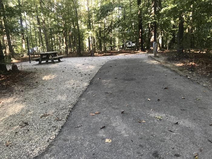 A photo of Site J012 of Loop J at TWIN KNOBS CAMPGROUND with Picnic Table, Electricity Hookup, Fire Pit, Shade, Tent Pad, Lantern Pole