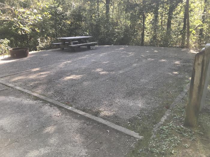 A photo of Site A033 of Loop A at TWIN KNOBS CAMPGROUND with Picnic Table, Electricity Hookup, Fire Pit, Shade, Tent Pad, Lantern Pole