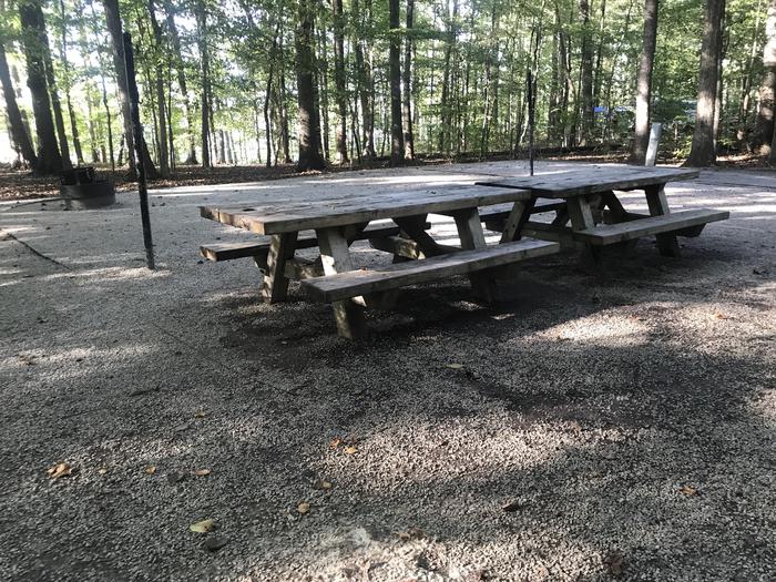 A photo of Site J014 of Loop J at TWIN KNOBS CAMPGROUND with Picnic Table, Electricity Hookup, Fire Pit, Shade, Tent Pad, Waterfront, Lantern Pole