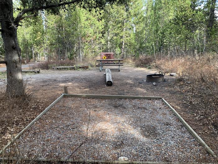 A photo of Site 67 of Loop 3 at Signal Mountain Lodge Campground with Picnic Table, Fire Pit, Shade, Food Storage, Tent Pad
