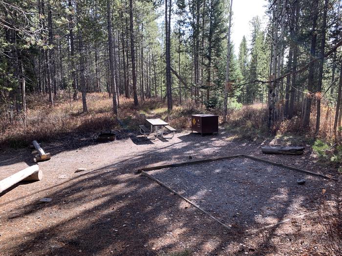 A photo of Site 75 of Loop 3 at Signal Mountain Lodge Campground with Picnic Table, Fire Pit, Shade, Food Storage, Tent Pad