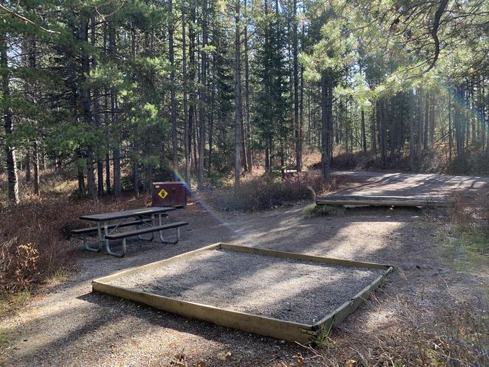 A photo of Site 77 of Loop 3 at Signal Mountain Lodge Campground with Picnic Table, Fire Pit, Shade, Food Storage, Tent Pad