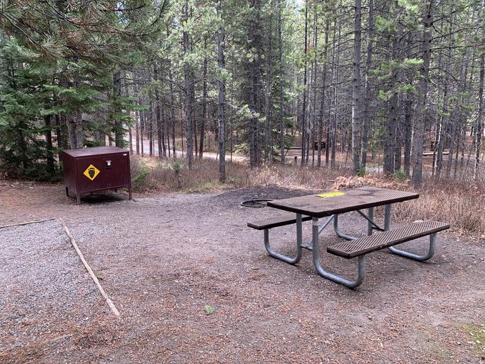 A photo of Site 83 of Loop 3 at Signal Mountain Lodge Campground with Picnic Table, Electricity Hookup, Fire Pit, Shade, Tent Pad