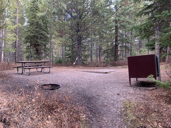 A photo of Site 83 of Loop 3 at Signal Mountain Lodge Campground with Picnic Table, Fire Pit, Shade, Food Storage, Tent Pad