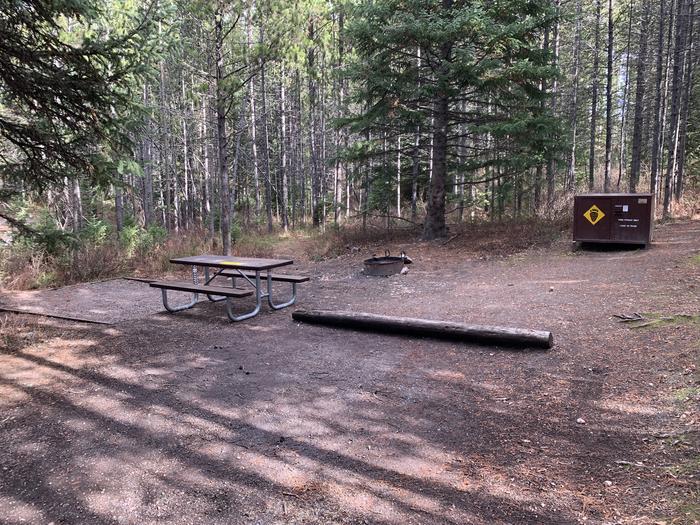 A photo of Site 86 of Loop 3 at Signal Mountain Lodge Campground with Picnic Table, Fire Pit, Shade, Food Storage, Tent Pad