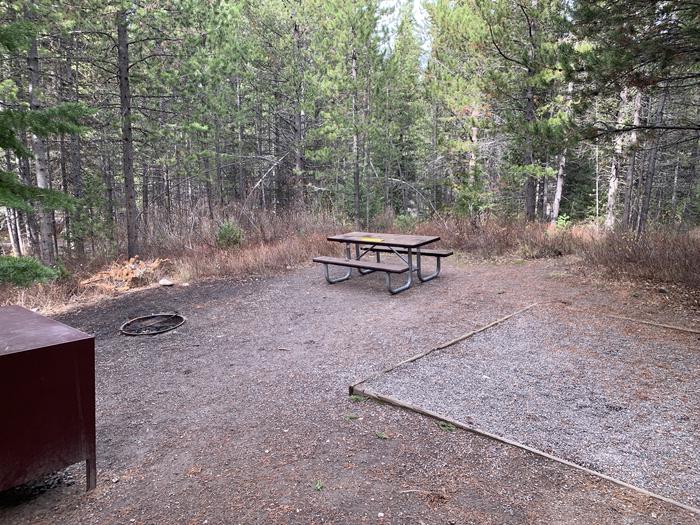 A photo of Site 83 of Loop 3 at Signal Mountain Lodge Campground with Picnic Table, Fire Pit, Shade, Food Storage, Tent Pad