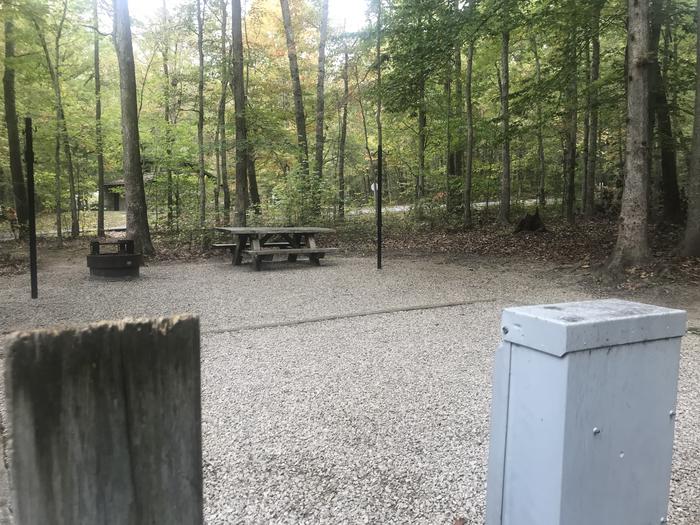 A photo of Site A022 of Loop A at TWIN KNOBS CAMPGROUND with Picnic Table, Electricity Hookup, Fire Pit, Shade, Tent Pad, Lantern Pole