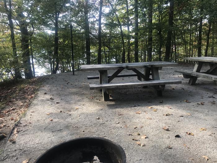 A photo of Site F028 of Loop F at TWIN KNOBS CAMPGROUND with Picnic Table, Fire Pit, Shade, Tent Pad, Lantern Pole