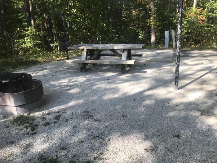 A photo of Site J022 of Loop J at TWIN KNOBS CAMPGROUND with Picnic Table, Electricity Hookup, Fire Pit, Shade, Tent Pad, Lantern Pole